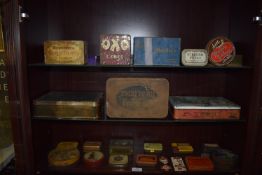 Three Shelves of Assorted Vintage Tins