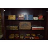 Three Shelves of Assorted Vintage Tins