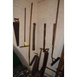 Items on Wall; Draining Rods, Angled Hoe, Saws, etc.