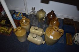 Six Stoneware and Two Glass Demijohns and Two Stoneware Bed Warmers
