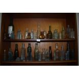 Two Shelves of Assorted Glass Bottles ~38 total