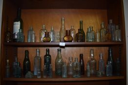 Two Shelves of Assorted Glass Bottles ~38 total