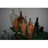 Collection of Glass Bottles and Three Norfolk Punch and One Other Stoneware Bottles