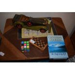 Travel Game, Rubik’s Cube, Wooden Toy Car, and Book