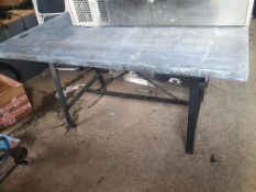 * Industrial style table with metal base and lead covered top. 1600w x 900d x 800h