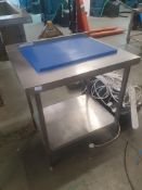 * S/S prep bench with upstand and undershelf. Includes blue chopping board. 800w x 650d x 900h