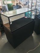 * glass display case with 3 drawers