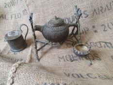 * tea pot, strainer and glass set