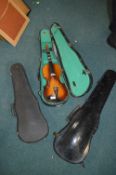 Three Violin Cases and One Violin