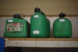 Three Green Plastic Fuel Cans