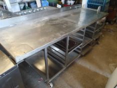 * S/S table on castors - with racks under. Extra deep. 2370w x 850d x 900h