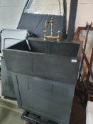 * very heavy sink with taps mounted on cupboard unit