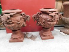 * Pair matching cast iron urns with snake and dove design 800x750(widest points) with 245mm centre