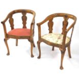 A pair of early 20thC walnut tub armchairs, with carved shell, harebell and foliate back rail and