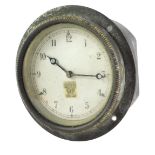 A Smiths Clock Company car clock, in black metal casing, on a silvered dial, 9cm wide.