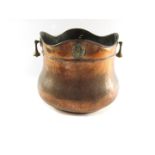 A Victorian copper coal bucket, with flared four point top, pear drop handles and applied brass