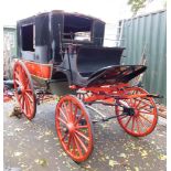 A horse drawn carriage, being a former museum exhibit deaccession in need of restoration. No