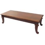 An Empire style mahogany coffee table, of rectangular section, raised on fluted scrolling legs,