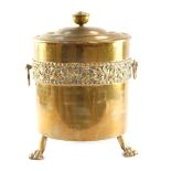 A brass coal box and cover, embossed with a band of mistletoe, on three lion's paw feet, 40cm high.