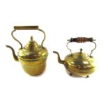 Two brass kettles, comprising a 19thC copper kettle, 31cm high, and a later teapot, with brown glass