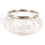 An Edward VII silver rimmed cut glass fruit bowl, the cut glass bowl with fold over silver rim,