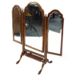 A Georgian style walnut tryptic dressing table mirror, inset bevelled glass, the central frame