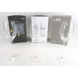 A set of twelve LSA white wine glasses, boxed.