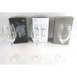 A set of twelve LSA white wine glasses, boxed.