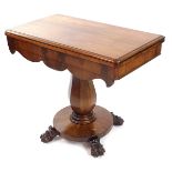 An early Victorian flame mahogany fold over tea table, with a shaped apron, raised on an octagonal