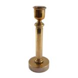 An early 20thC solid brass candlestick, with snuffer lid, 32.5cm high.