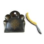 A Victorian papier mache crumb scoop and matching brush, the moulded scoop with gilt decoration,