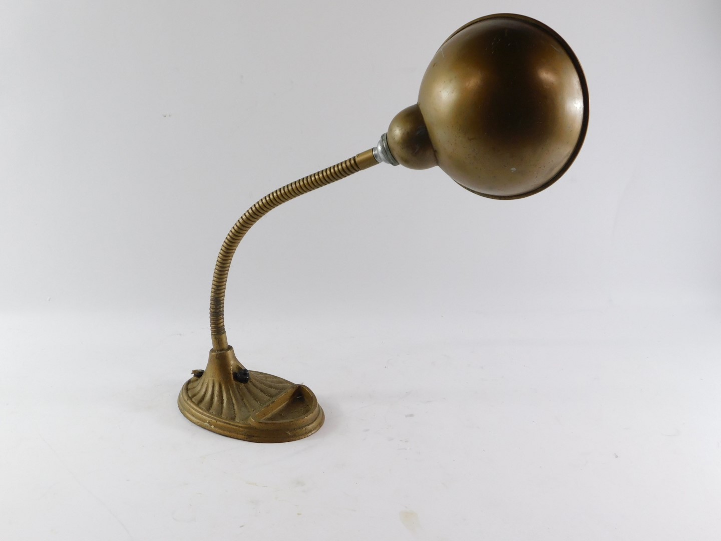A continental early 20thC metal desk lamp, the domed shade on an angular stem, and a fluted base, - Image 2 of 4