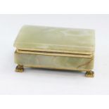 A 1970's Italian onyx and brass bound cigarette box, of domed rectangular form, 6cm high, 13cm wide,