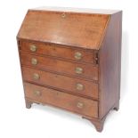 A George III oak and mahogany cross banded bureau, the fall flap opening to reveal a central drawer,