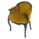 A Victorian mahogany tub chair, upholstered in button back yellow draylon, with over stuffed seat,