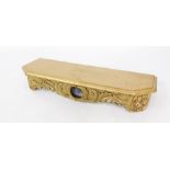 A Continental gilt resin wall shelf, with rococo scroll and floral decoration, 75cm wide, 23cm deep.