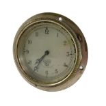 A Smiths Clock Company car clock, in silvered outer casing, on a silvered dial, 9cm wide.