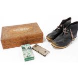 A pair of early 20thC leather clogs, a Hohner Echo Harp harmonica, and an Anglo Indian wooden and