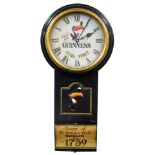 A Guinness advertising wall clock, the circular dial with Arabic numerals and Always Time For A