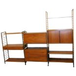 A group of Staples Ladderax shelving units, with gilt metal supports, in three sections,