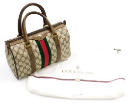 A vintage Gucci Ophidia canvas bowling bag, with brown leather trim and handles, the interior with a