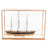 A wooden scale model of The Cutty Sark, three masted clipper complete with lifeboats, rigging, etc.,