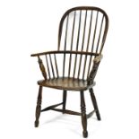 A 19thC ash and elm Windsor chair, with spindle turned back, solid seat, on a H stretcher. (AF)