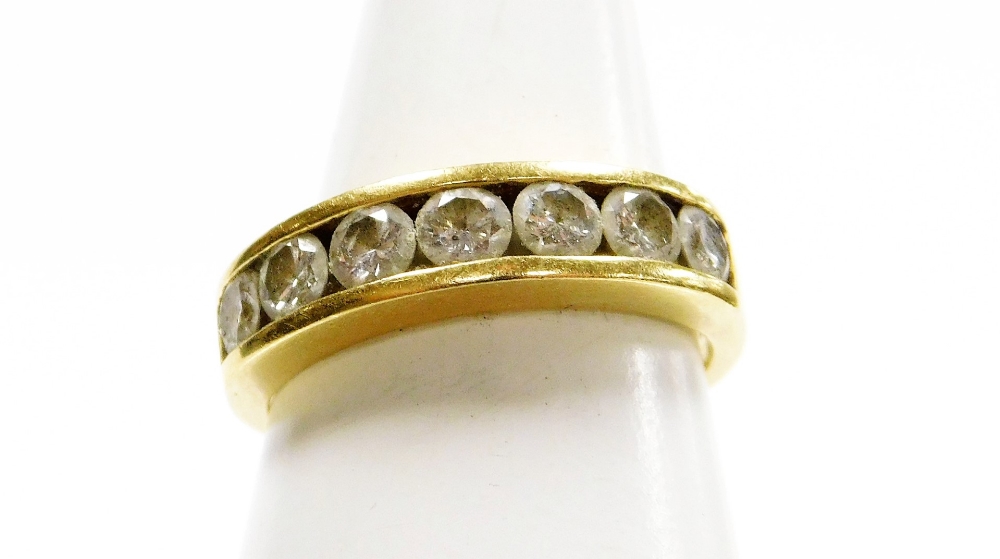 Withdrawn presale by vendor- An 18ct gold diamond half hoop dress ring, set with seven tension set