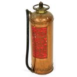 A vintage Waterloo copper fire extinguisher made by Reid and Campbell Limited, London, 56cm high.