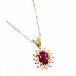 Withdrawn presale by vendor- A ruby and diamond pendant, the cluster pendant with central oval cut