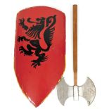 A painted metal shield, in red with stencilled dragon decoration, 83cm high, and a double edged axe.