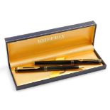 A Waterman 'Ideal' Paris fountain pen, in black with an 18k nib, and a matching ballpoint pen,