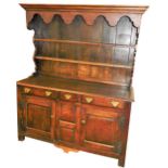 A late 18th/early 19thC oak dresser, the associated raised back with a later cornice above a