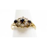 A 9ct gold cluster ring, the central cluster set with blue and white paste stones formed as a flower